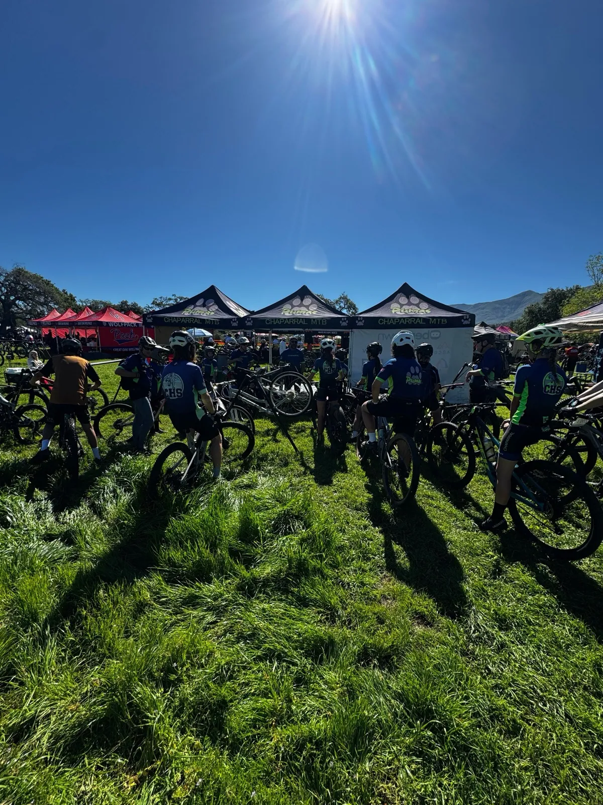 The Chaparral MTB team with their bikes under the team tents on race day